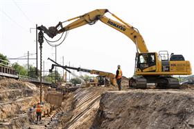 Transportation & Structures: A Haines & Kibblehouse, Inc. crew works alongside a railroad right of way.